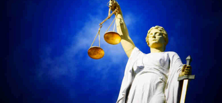 statue holding scales of justice