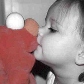toddler kissing Sesame Street Elmo