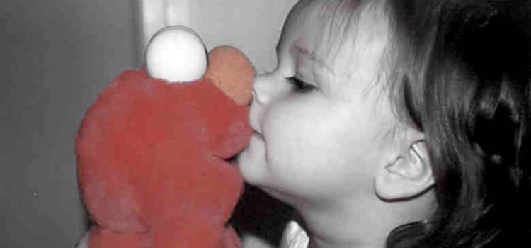 toddler kissing Sesame Street Elmo